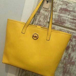 Yellow MK jet set travel tote
